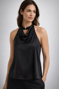 Woman wears black sleeveless blouse.
